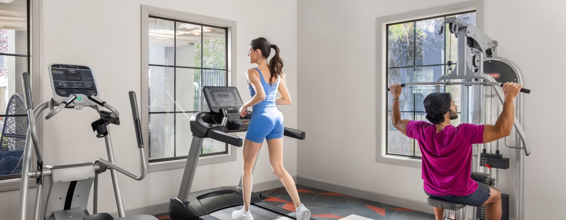 man and woman in fitness center