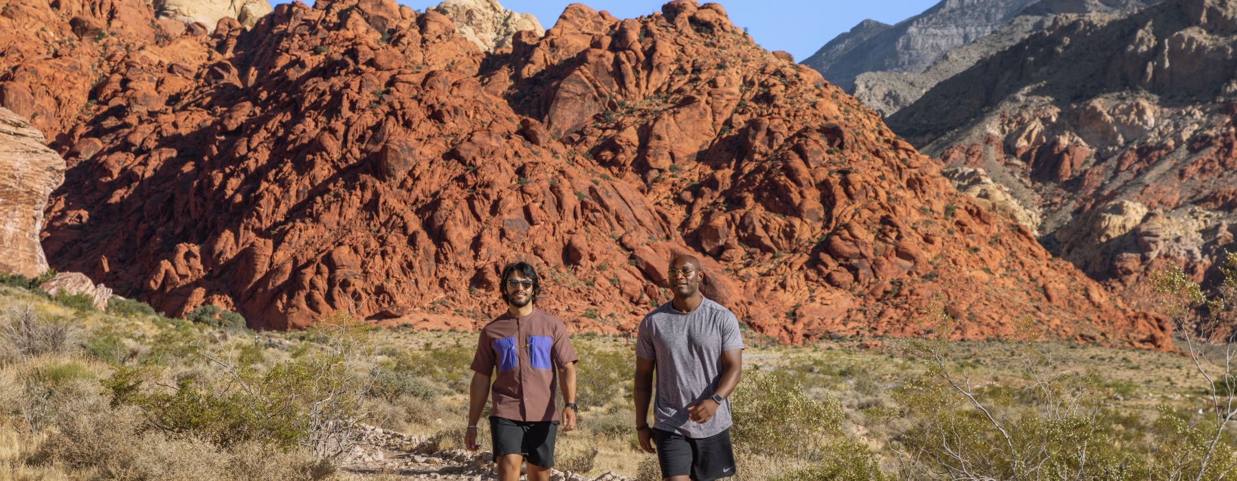 two people hiking in the mountains