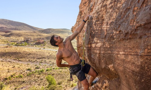 man rock climbing